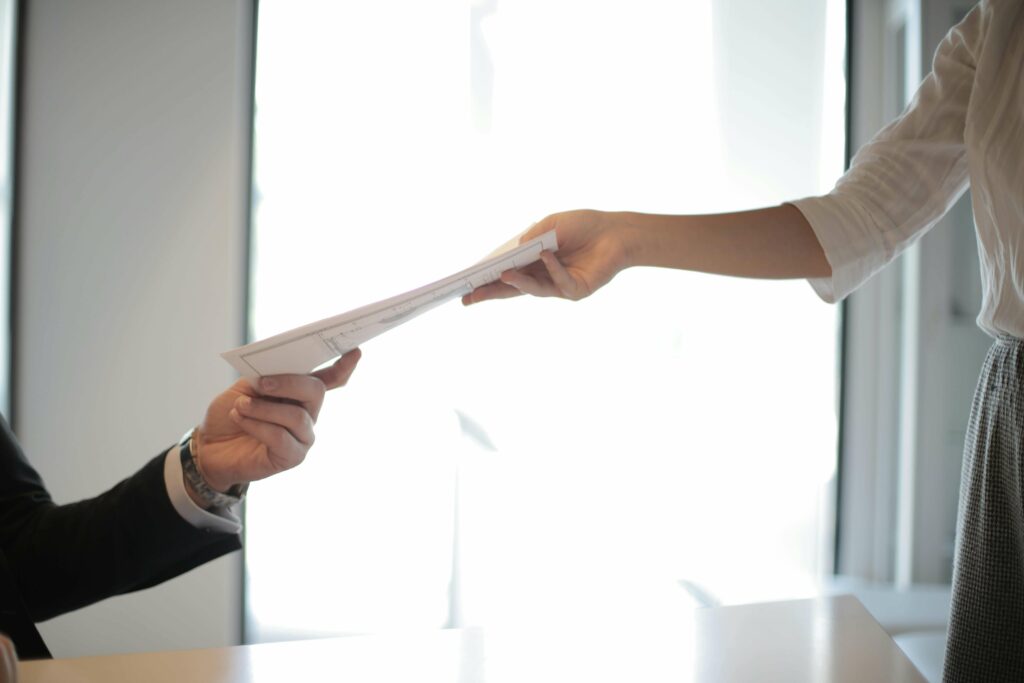 An insurance document exchanges hands