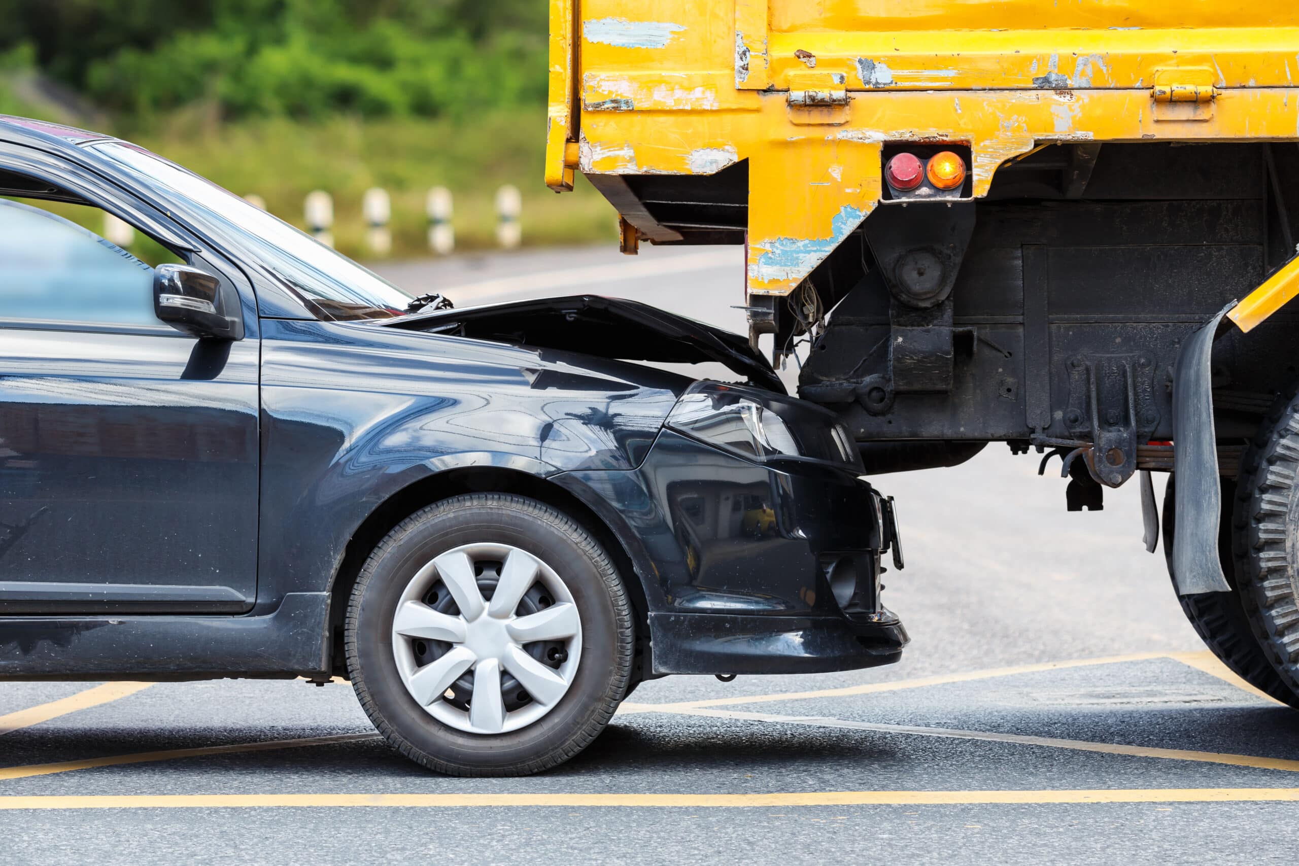 accident-on-the-road-involving-black-car-and-yellow-truck