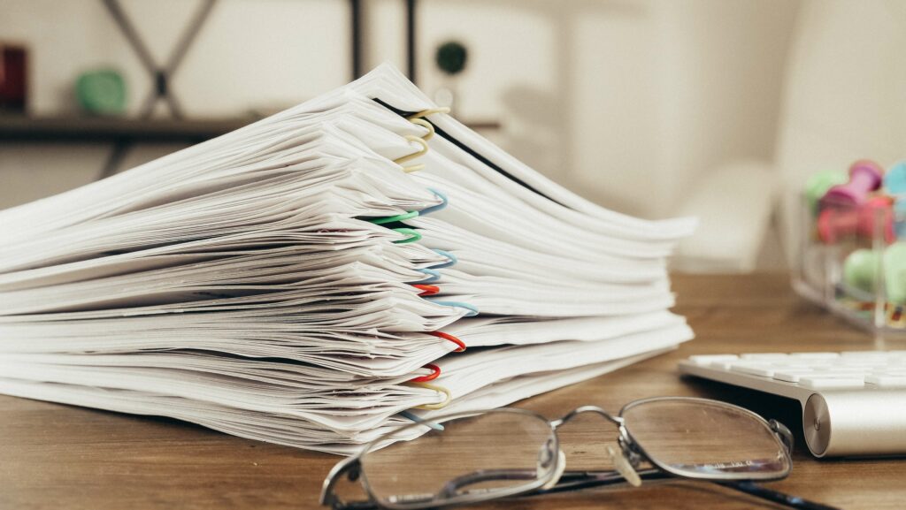 A close-up of a stack of supporting medical records