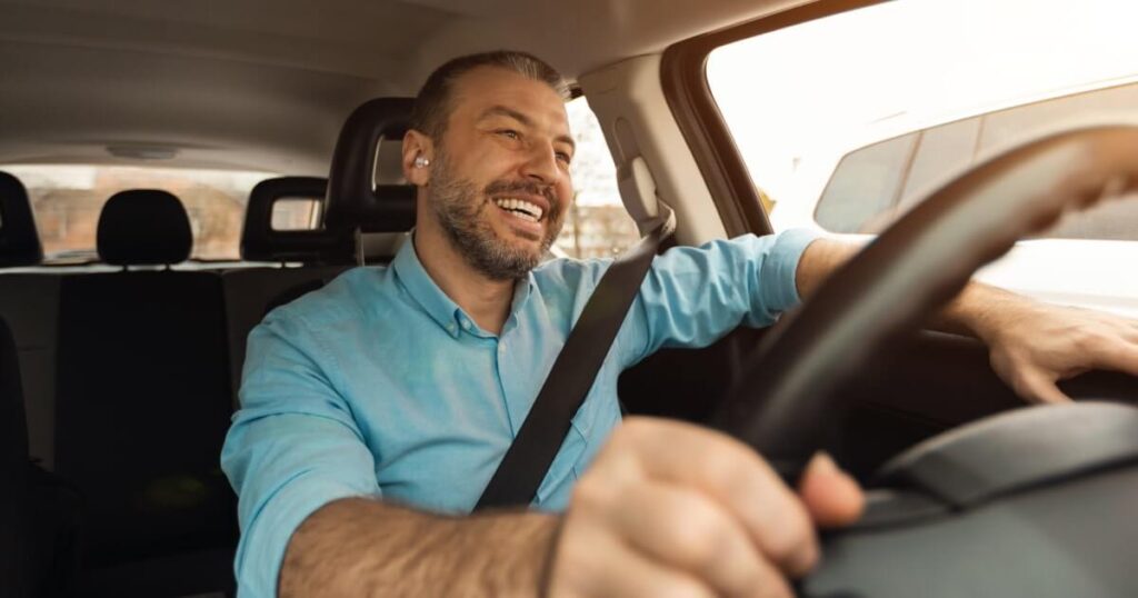 A man drives comfortably
